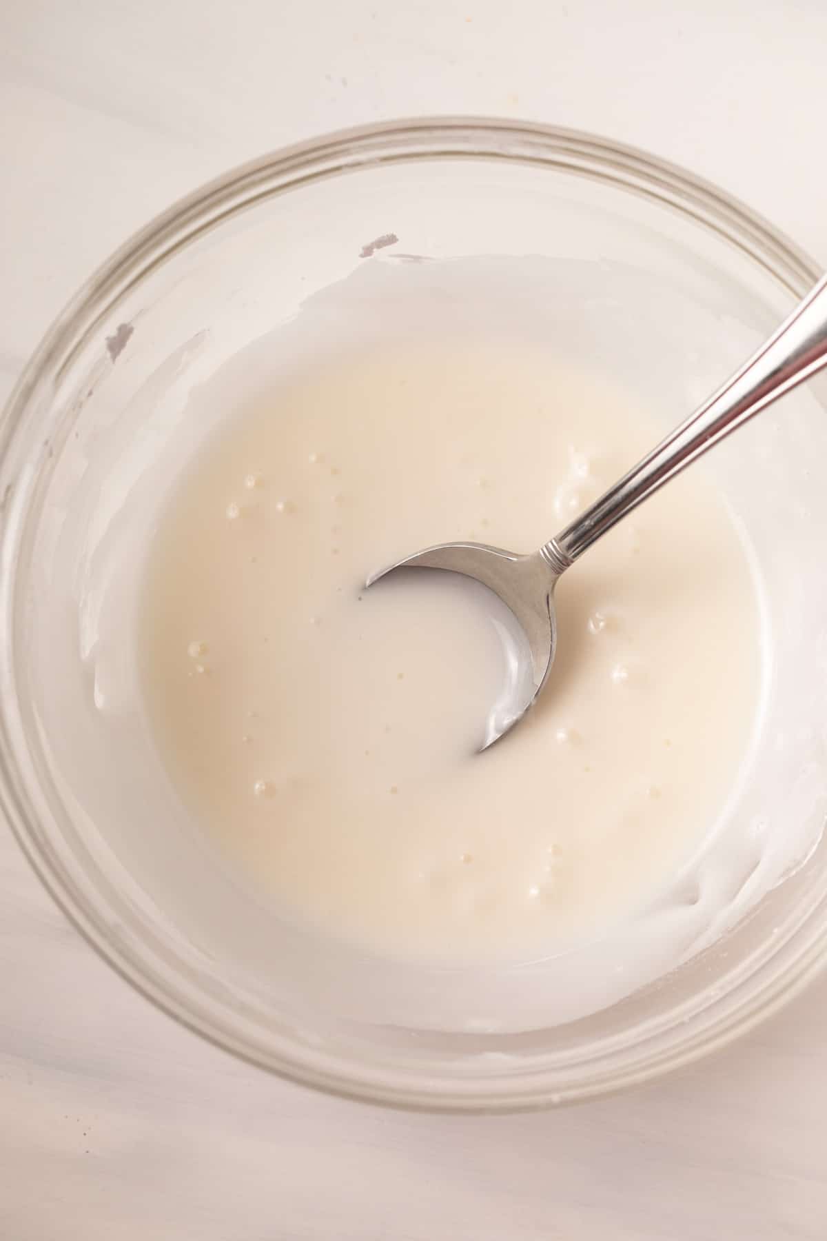 Almond icing in a glass bowl.