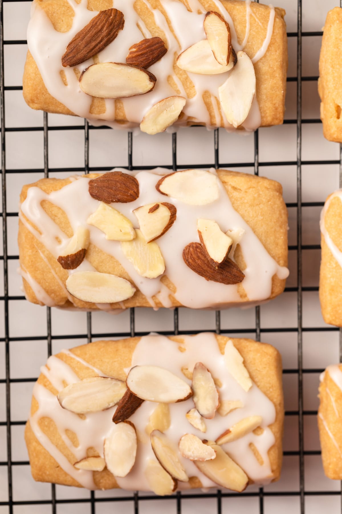 Close up of almond bars on a wire rack.