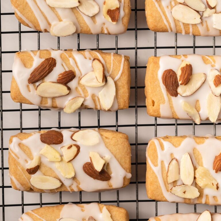 Almond bars on a wire rack.