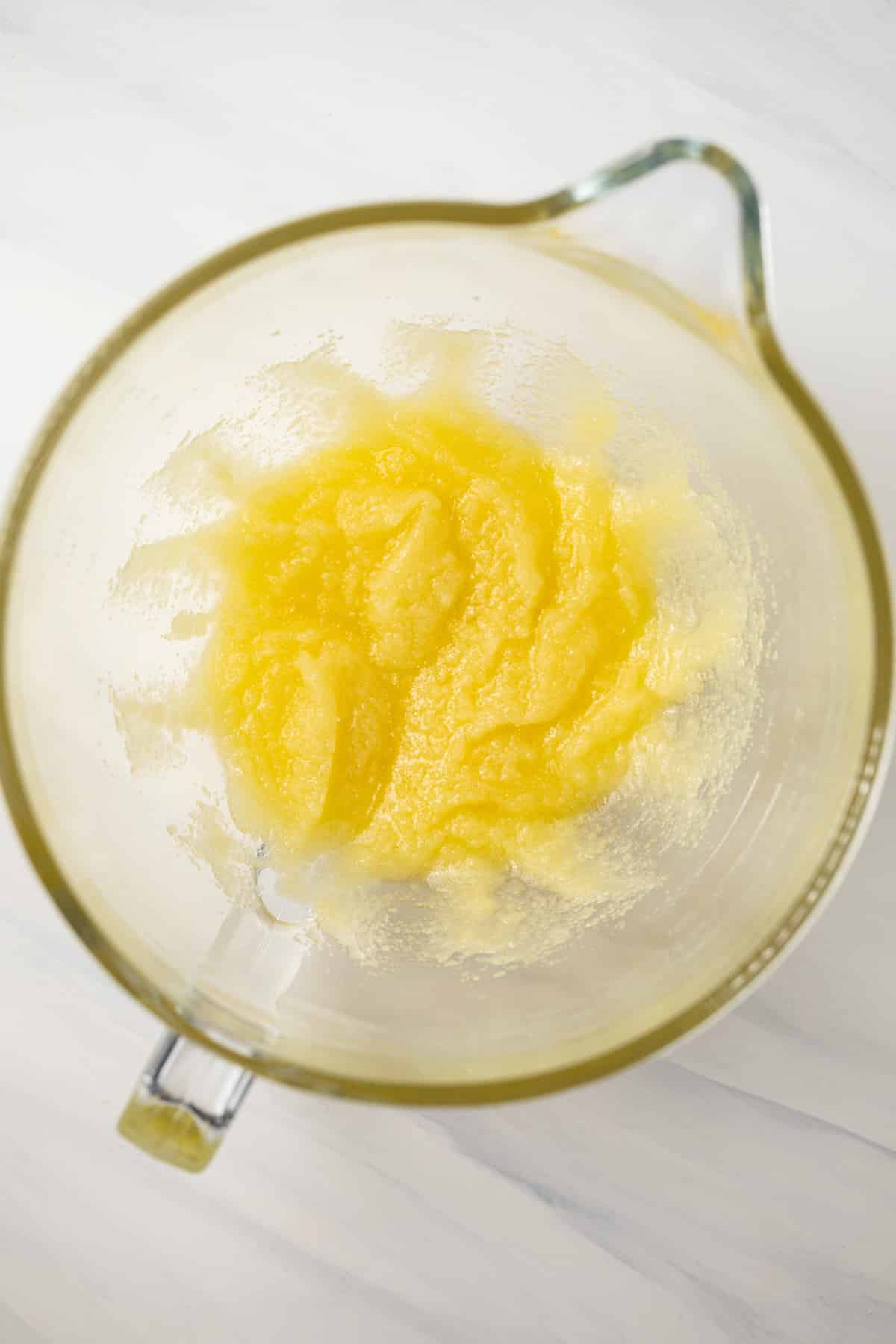 Butter, oil, and sugar mixed in bowl.