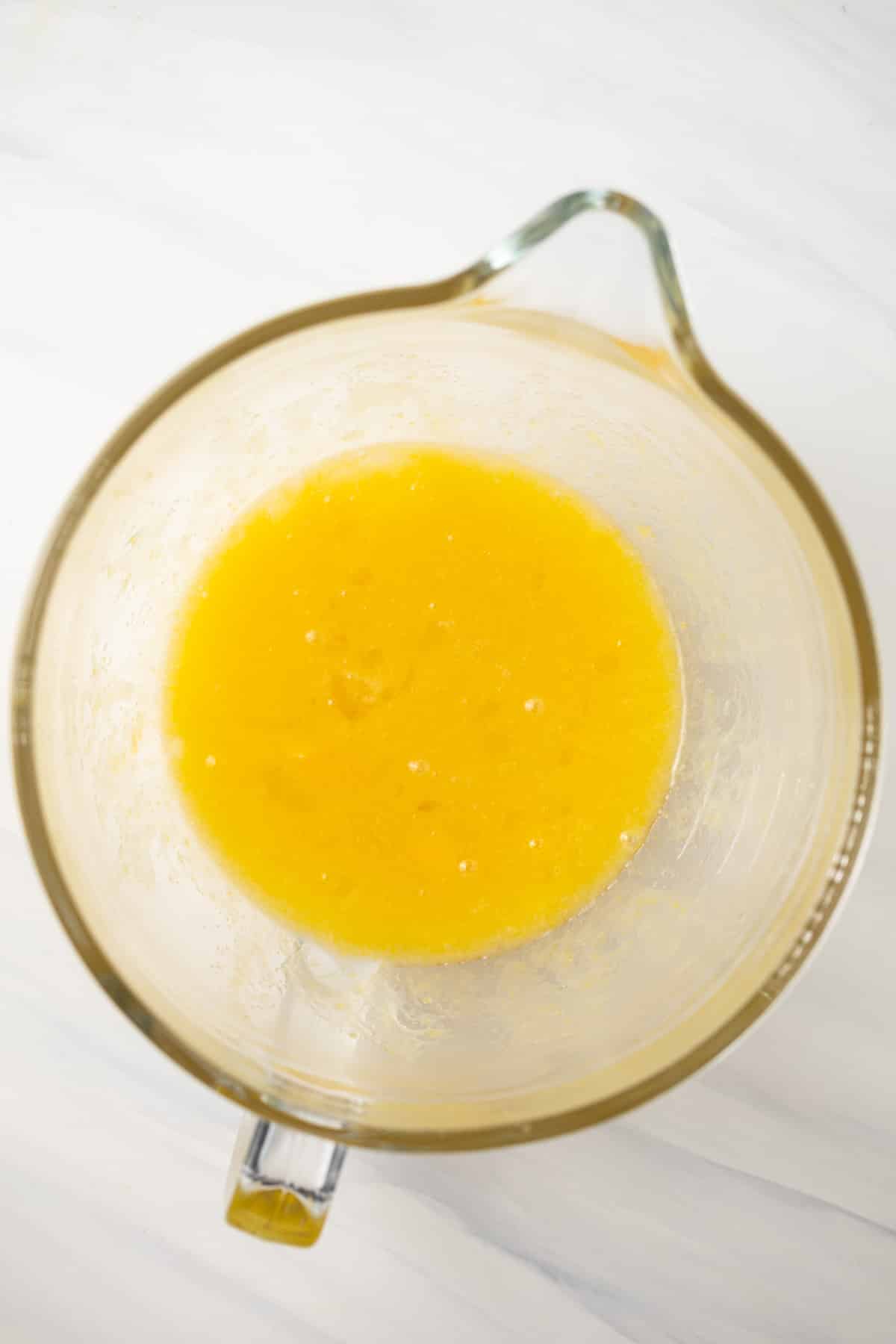 Liquid ingredients mixed in mixing bowl.