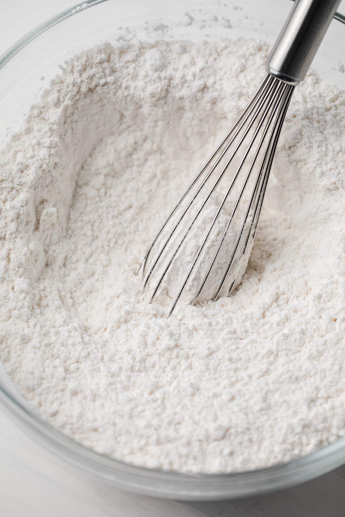 Dry ingredients mixed in glass bowl.