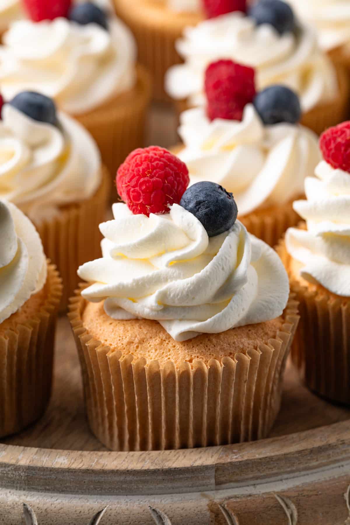Close up of angel food cupcakes on cake stand.