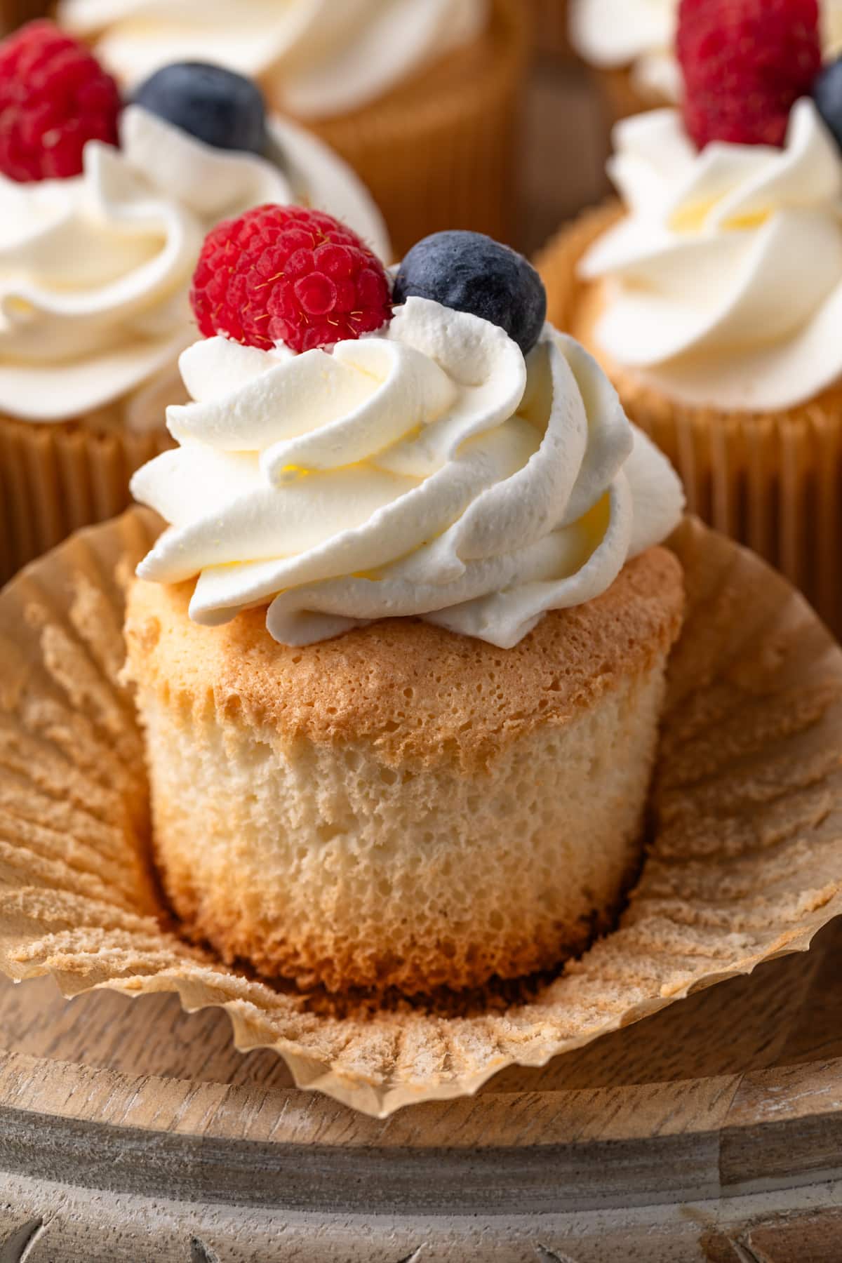 Angel food cupcake with wrapper pulled away.