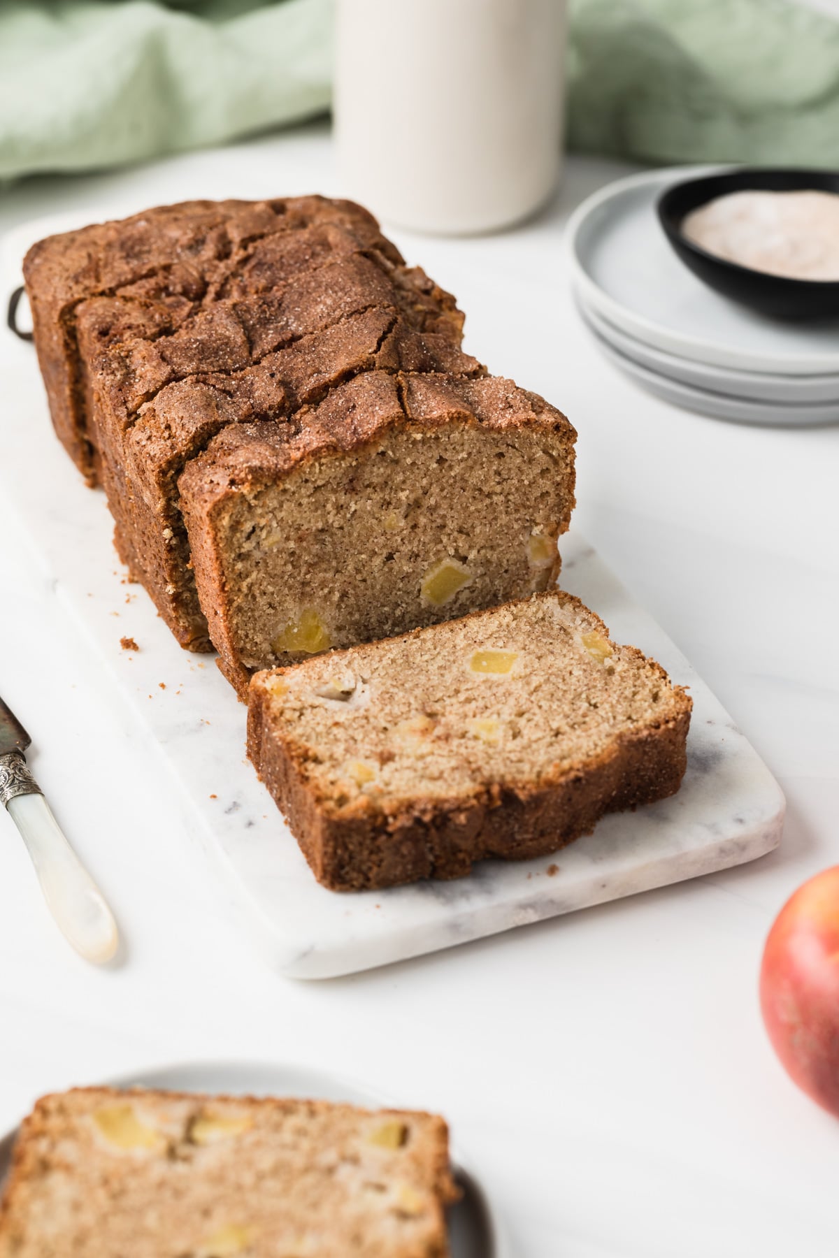 apple bread on marble slab with slices cut out