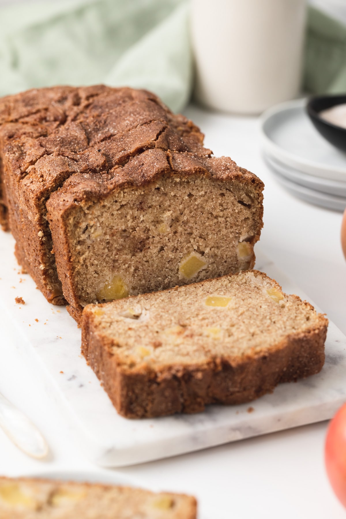 apple bread on marble slab with slices cut out