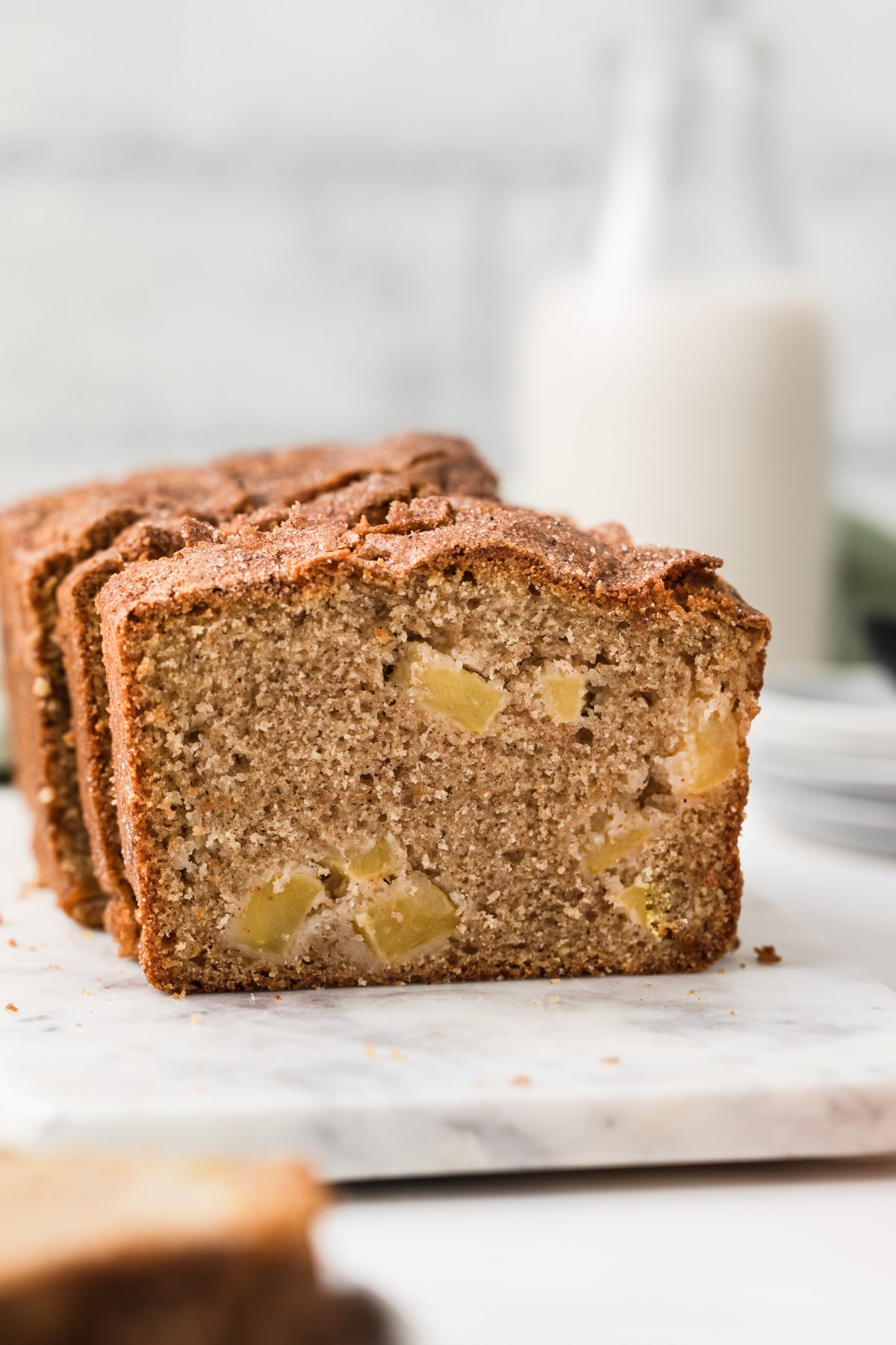 front view of open face apple bread on marble slab