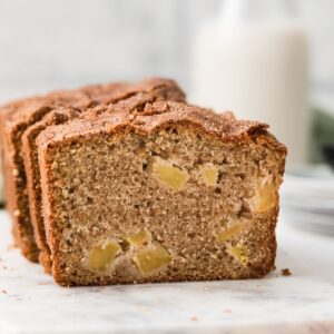 front view of open face apple bread on marble slab