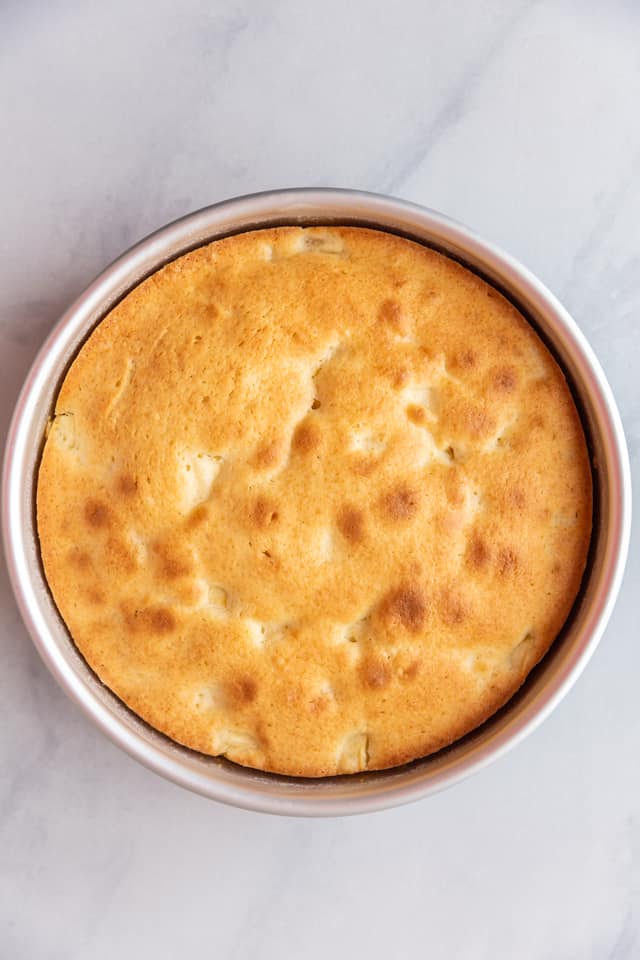 overhead view of a baked apple cake in a pan