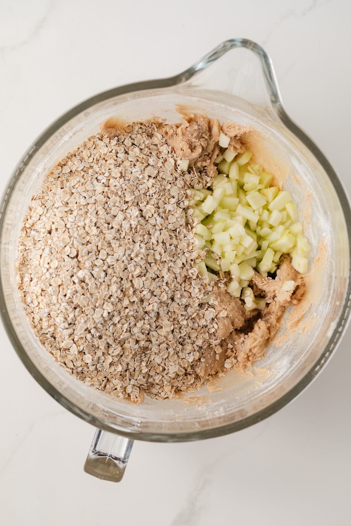 Oats and apple slices in cookie batter.