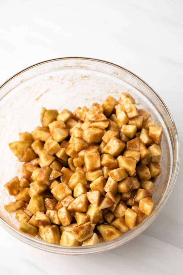 Apples chunks coated in cinnamon sugar