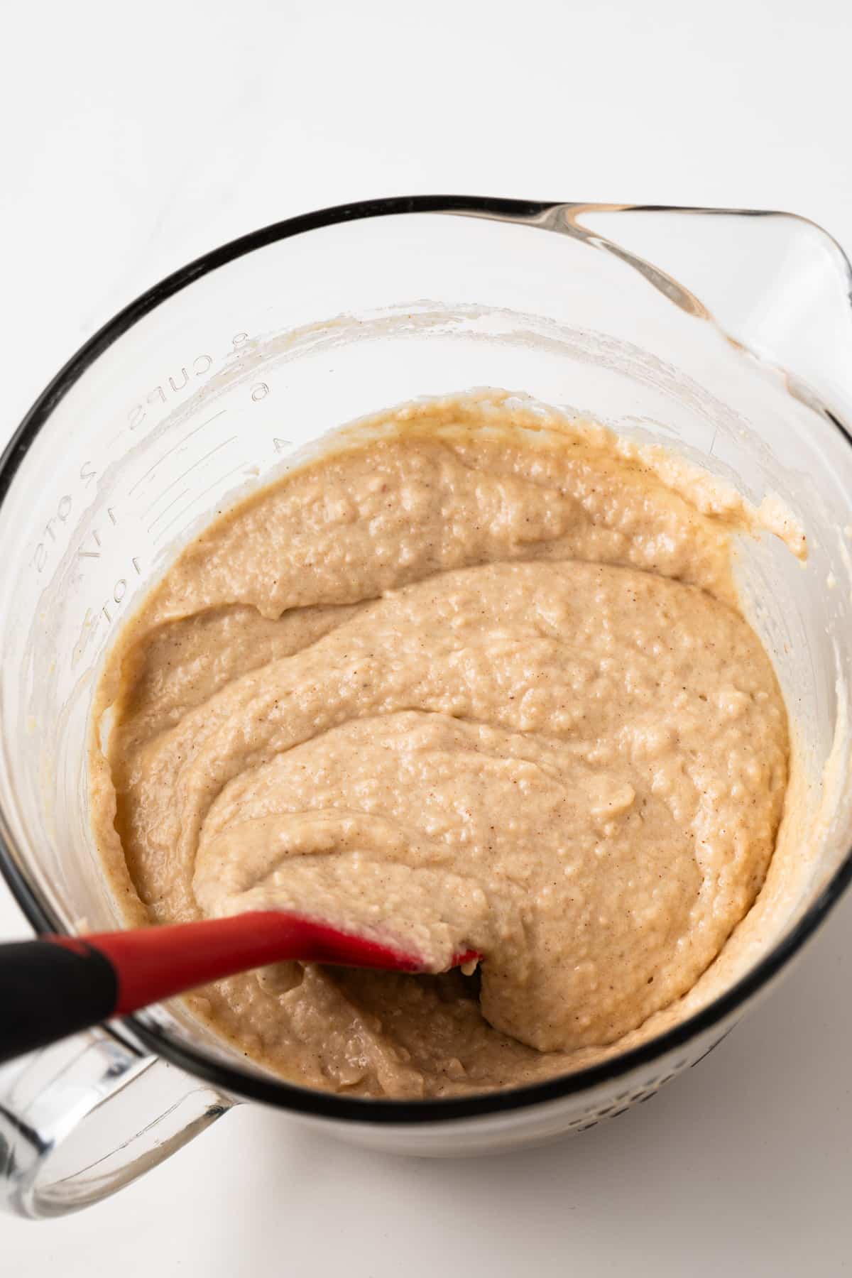 Cake batter in a glass mixing bowl.