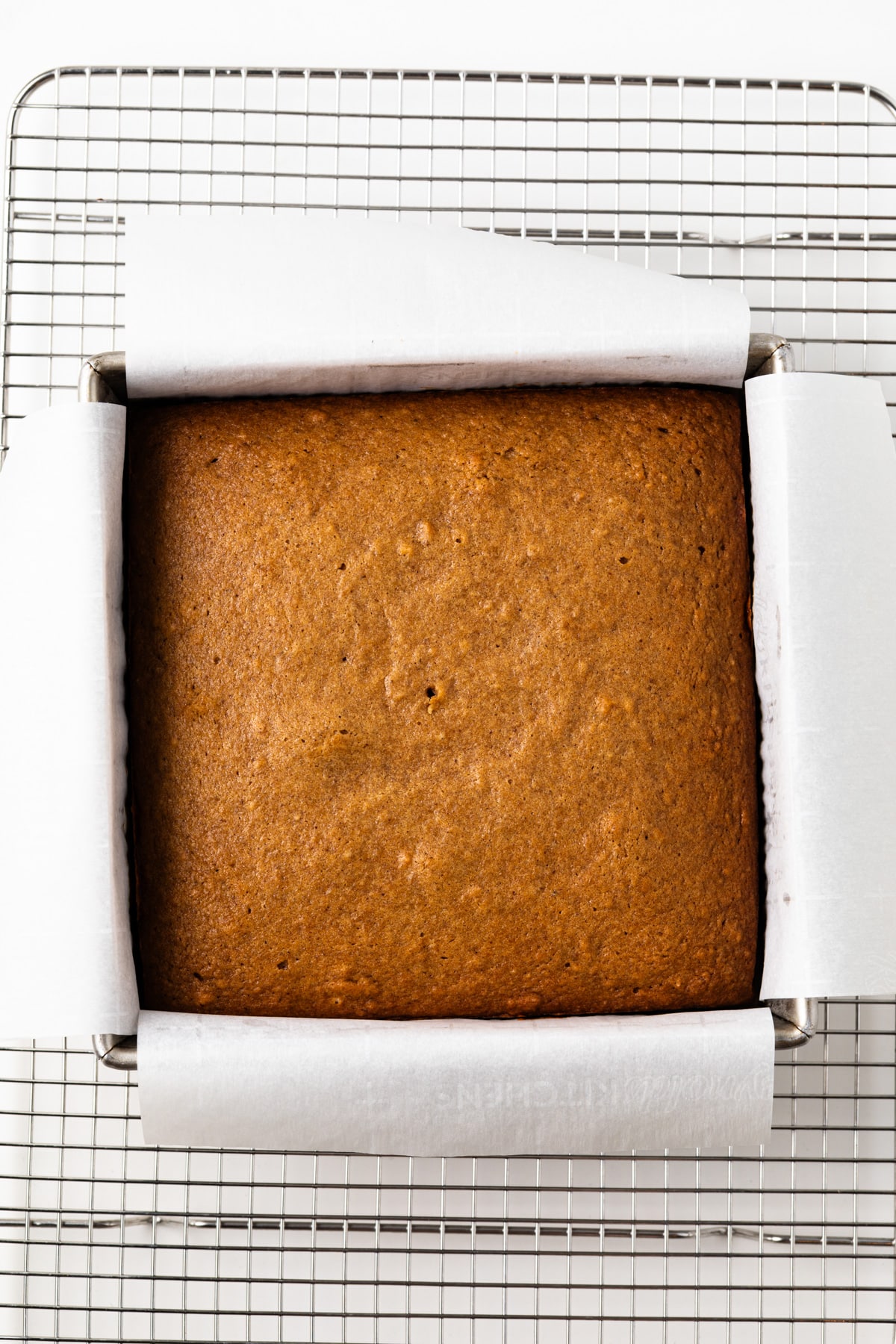 Baked applesauce cake in a pan.