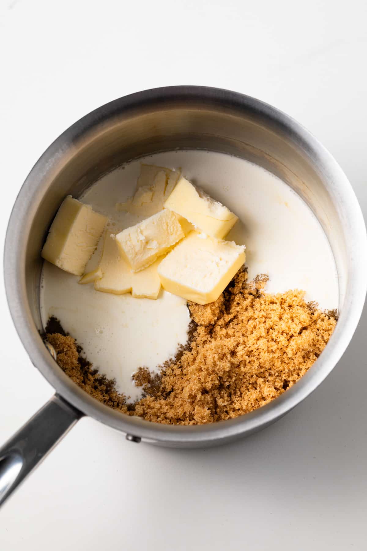 Ingredients for caramel glaze in a pot.