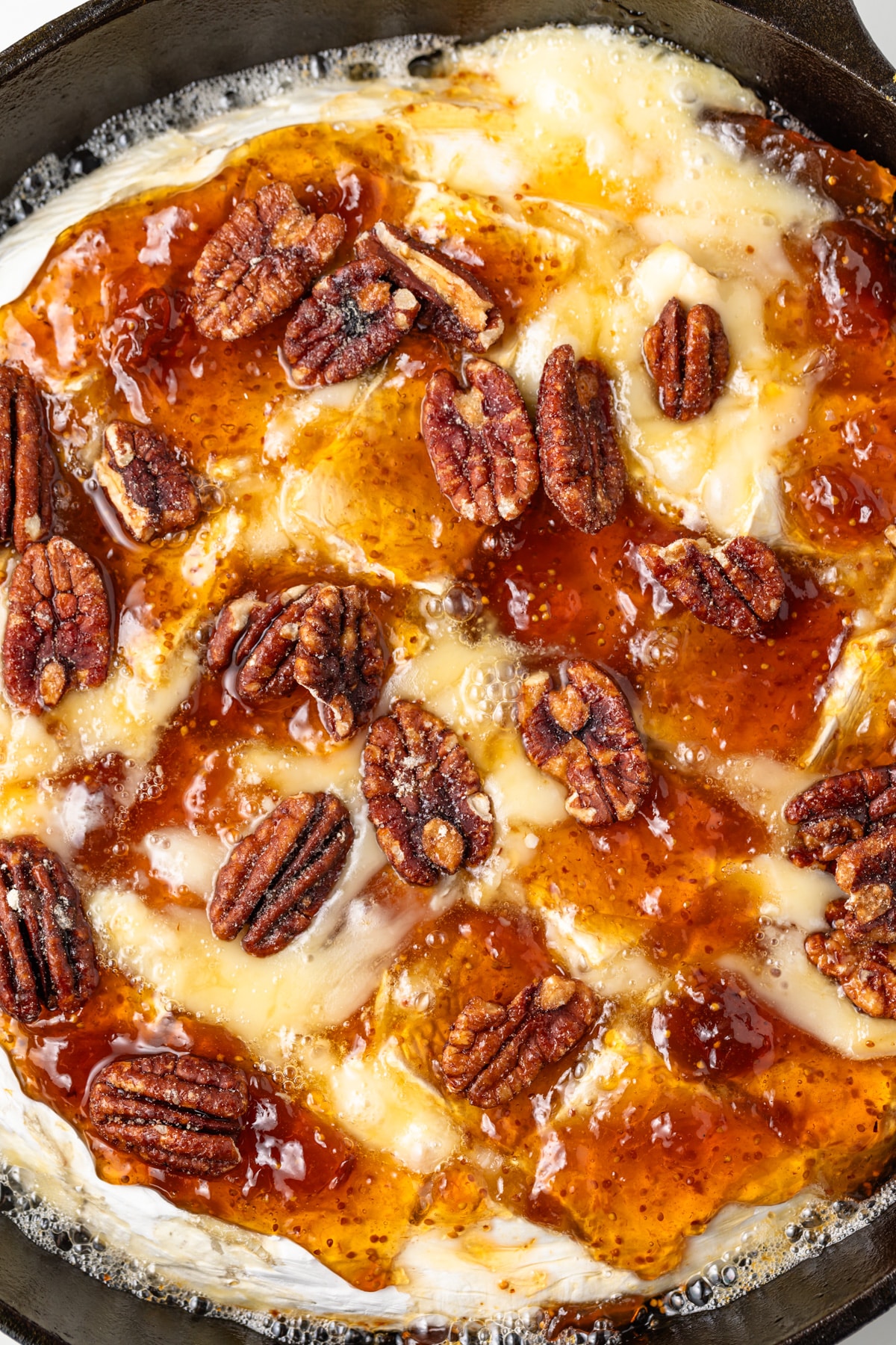 Baked brie topped with glazed pecans.