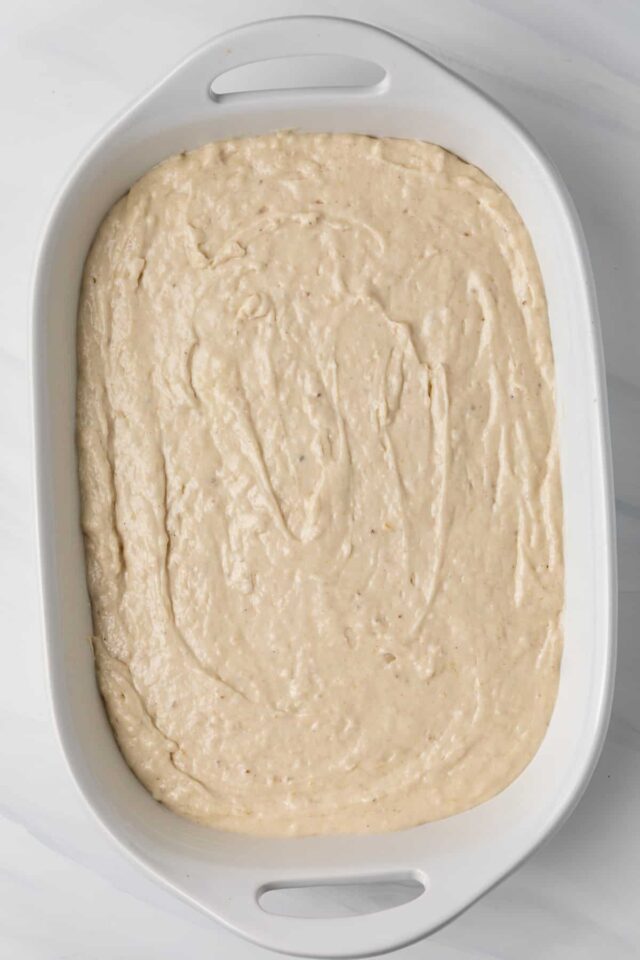 Banana cake batter in a baking pan