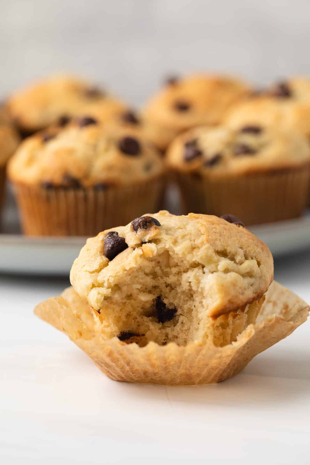 Banana chocolate chip muffin with bite taken out.