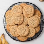 Overhead of banana cookies on a wire rack.