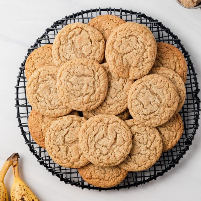 Overhead of banana cookies on a wire rack.
