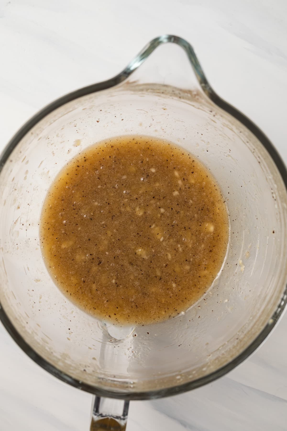 Mashed banana in mixing bowl.