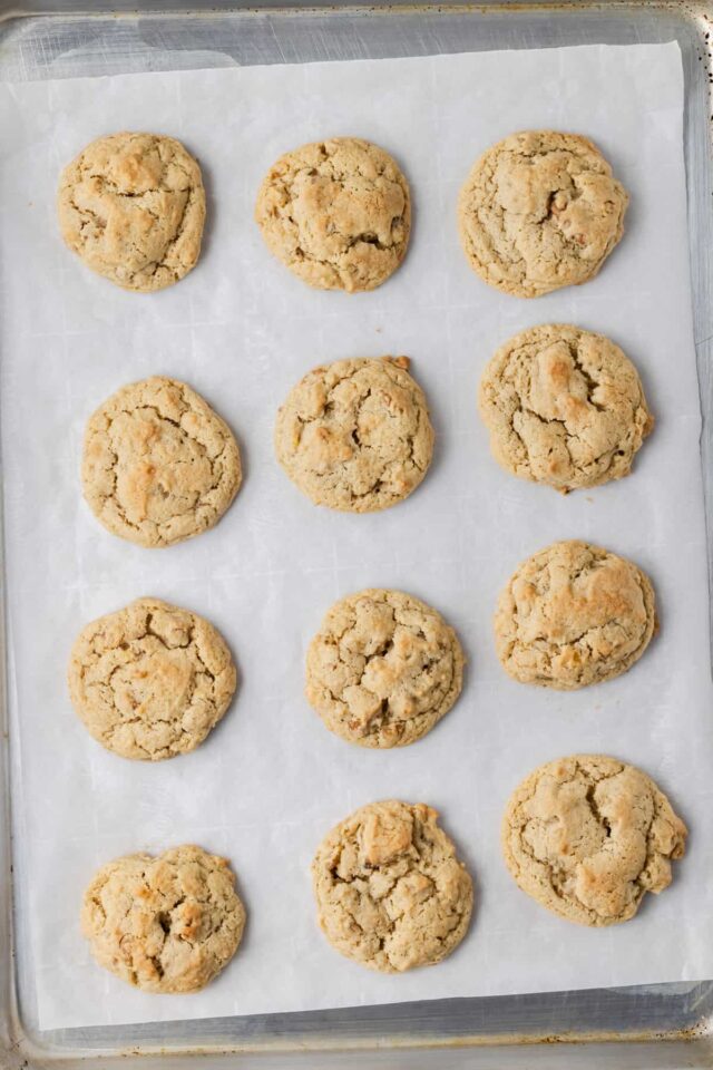 Freshly baked banana nut bread cookies on a baking sheet