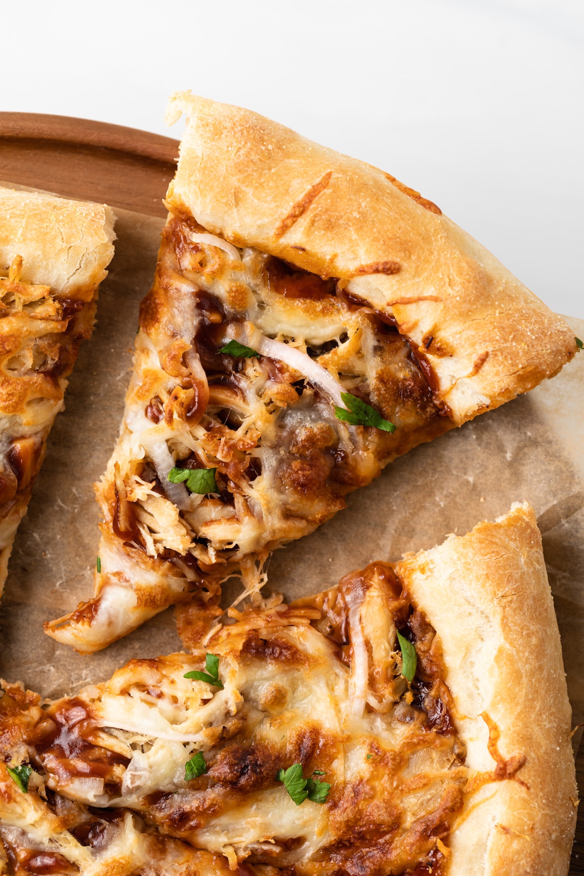 close up of slice of bbq chicken pizza