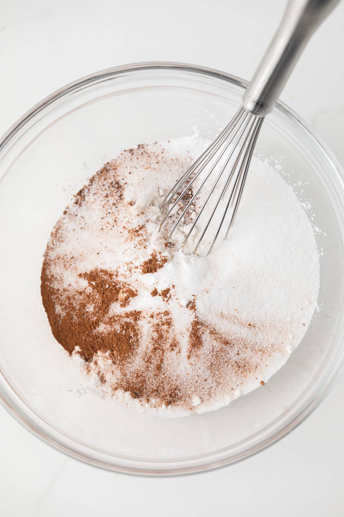 Dry ingredients mixed in glass bowl.
