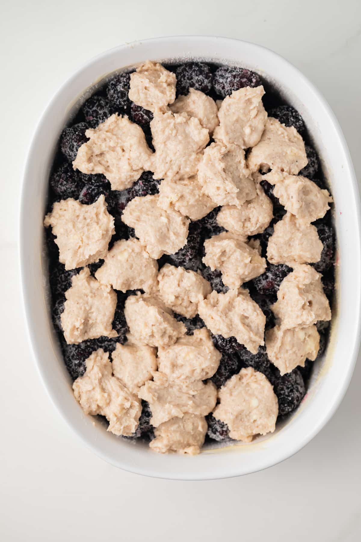 Blueberries in casserole topped with cobbler topping.