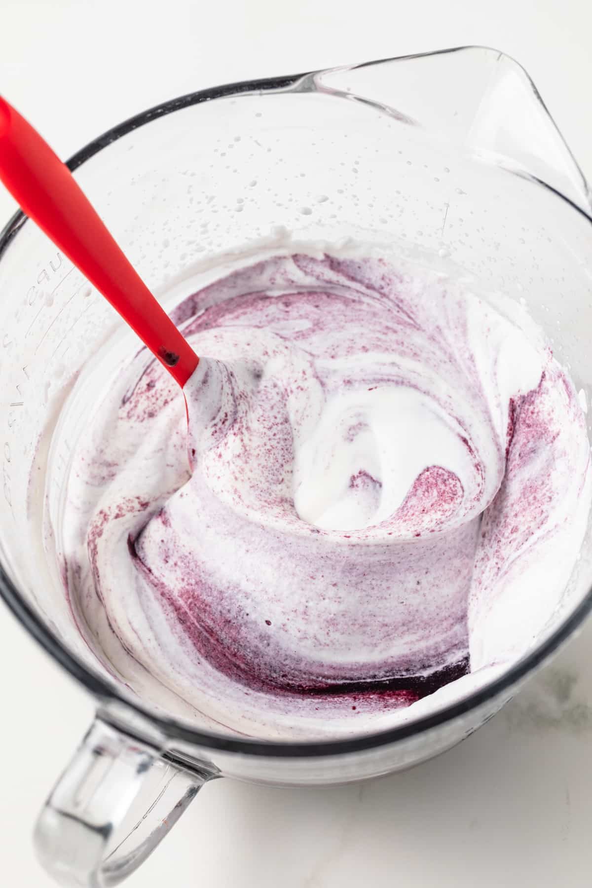 Blackberry fool in glass bowl.