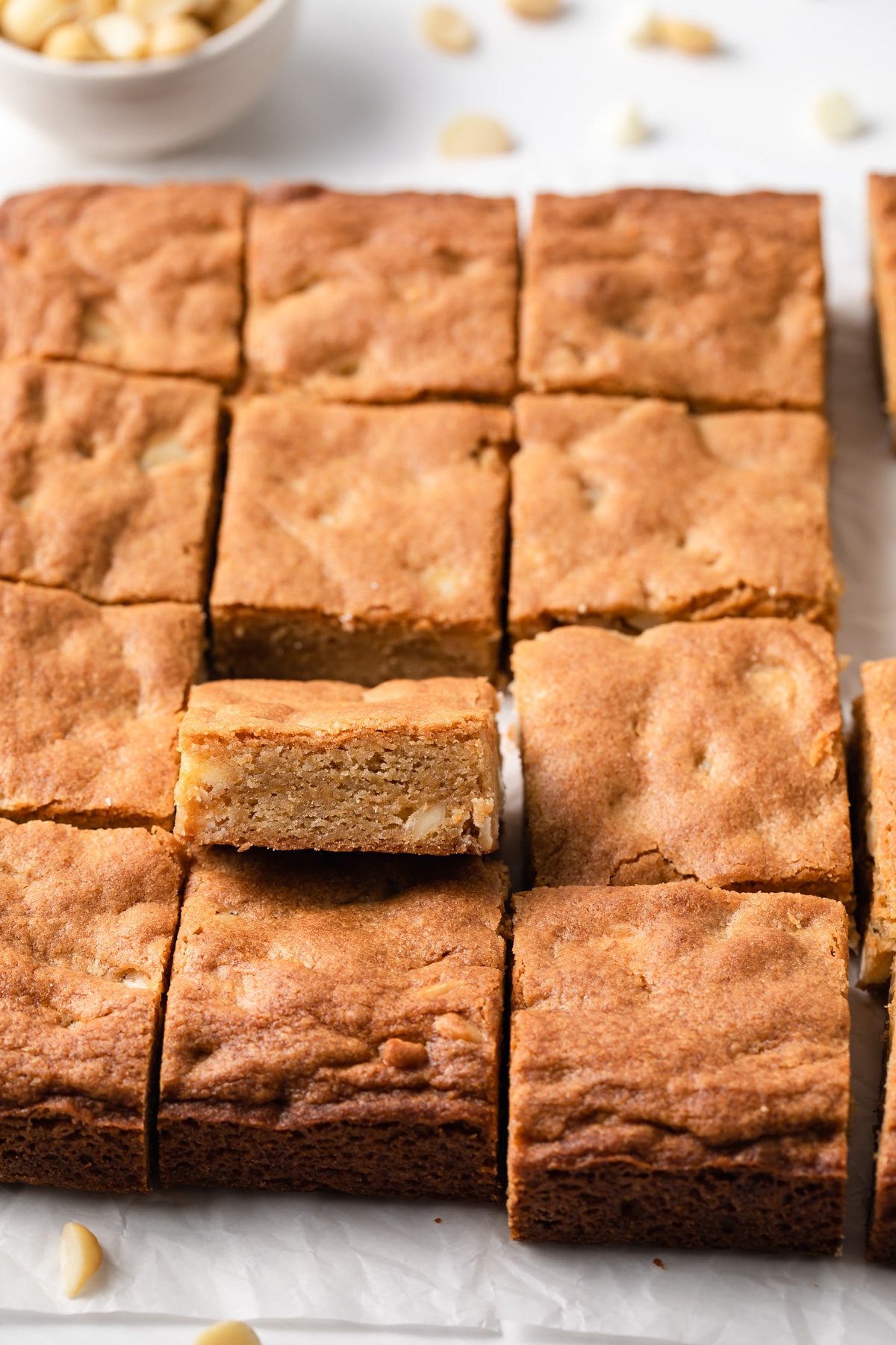 blondie dessert bars with one propped up so the inside is visible