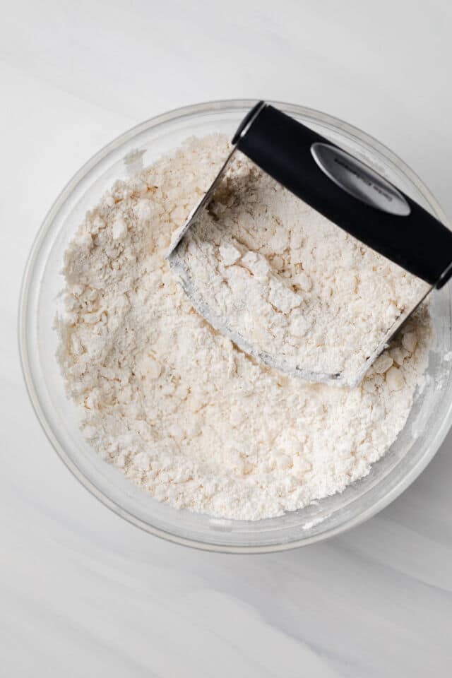 Butter cut into flour with pastry blender.