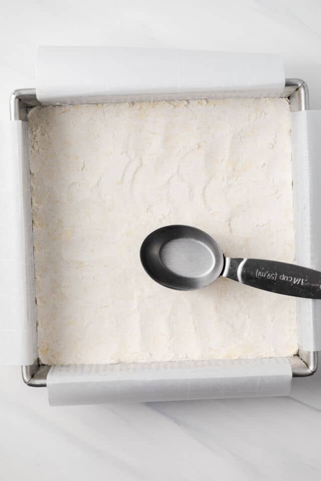 Shortbread crust pressed into baking pan.