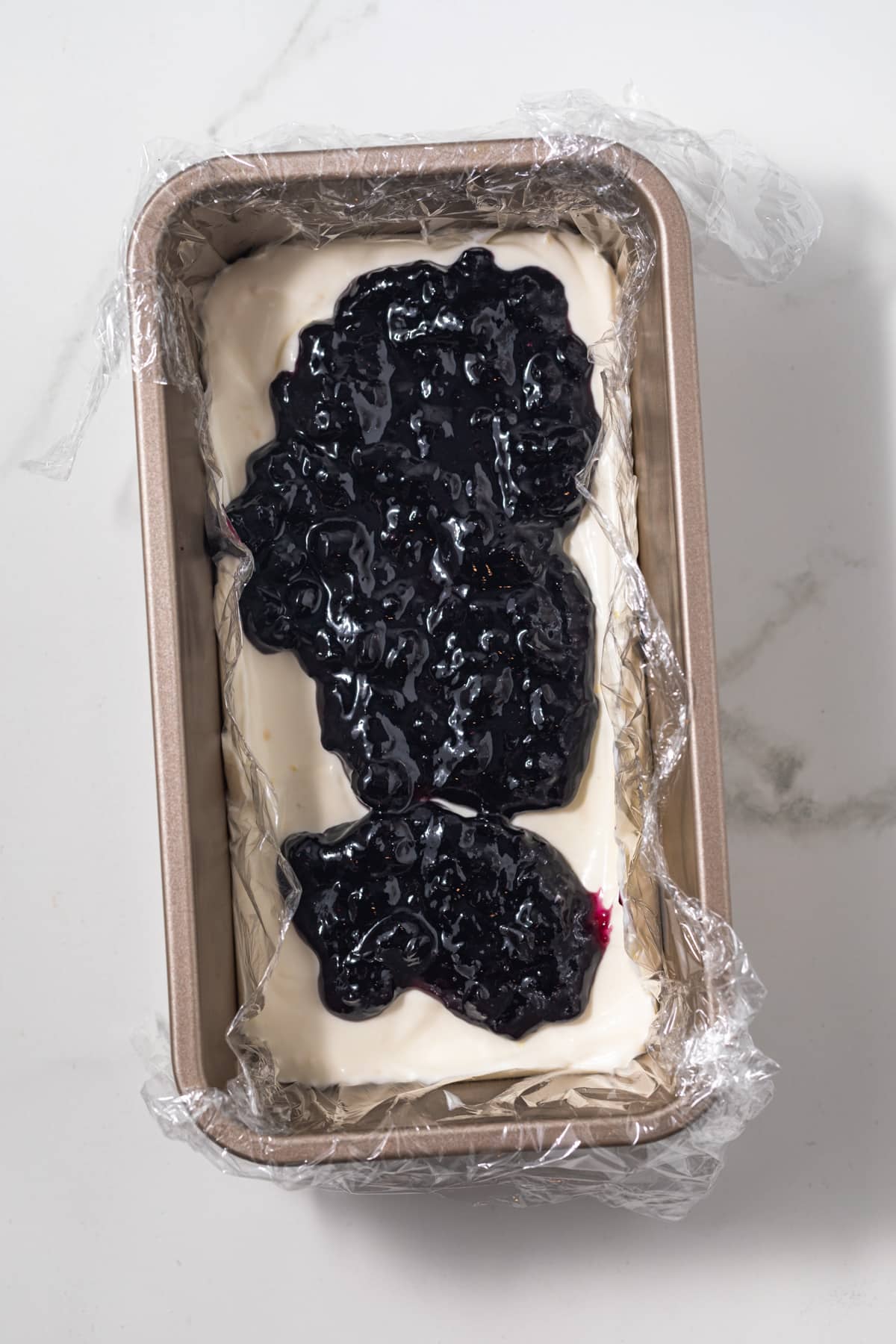 Blueberry jam layered over lemon whipped cream.