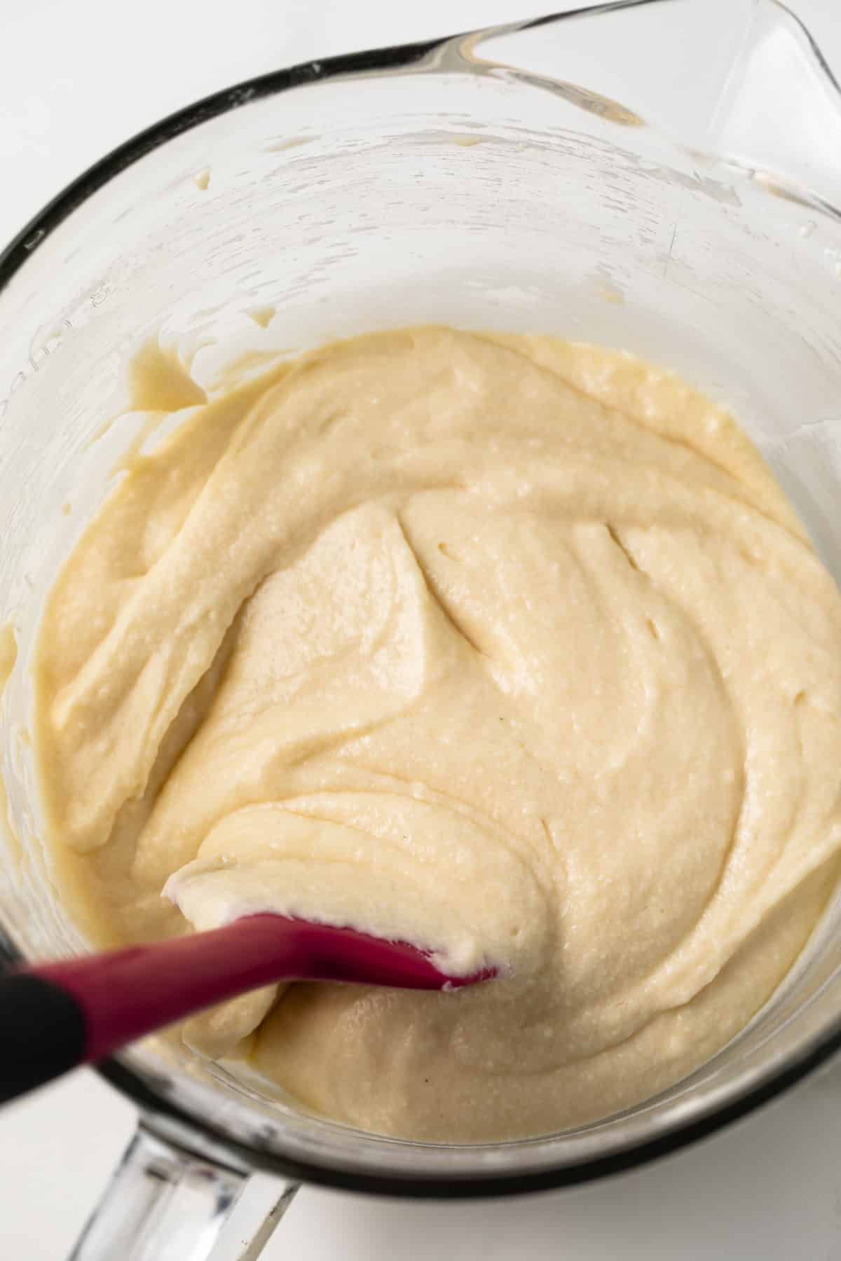Yellow cake batter in glass bowl.