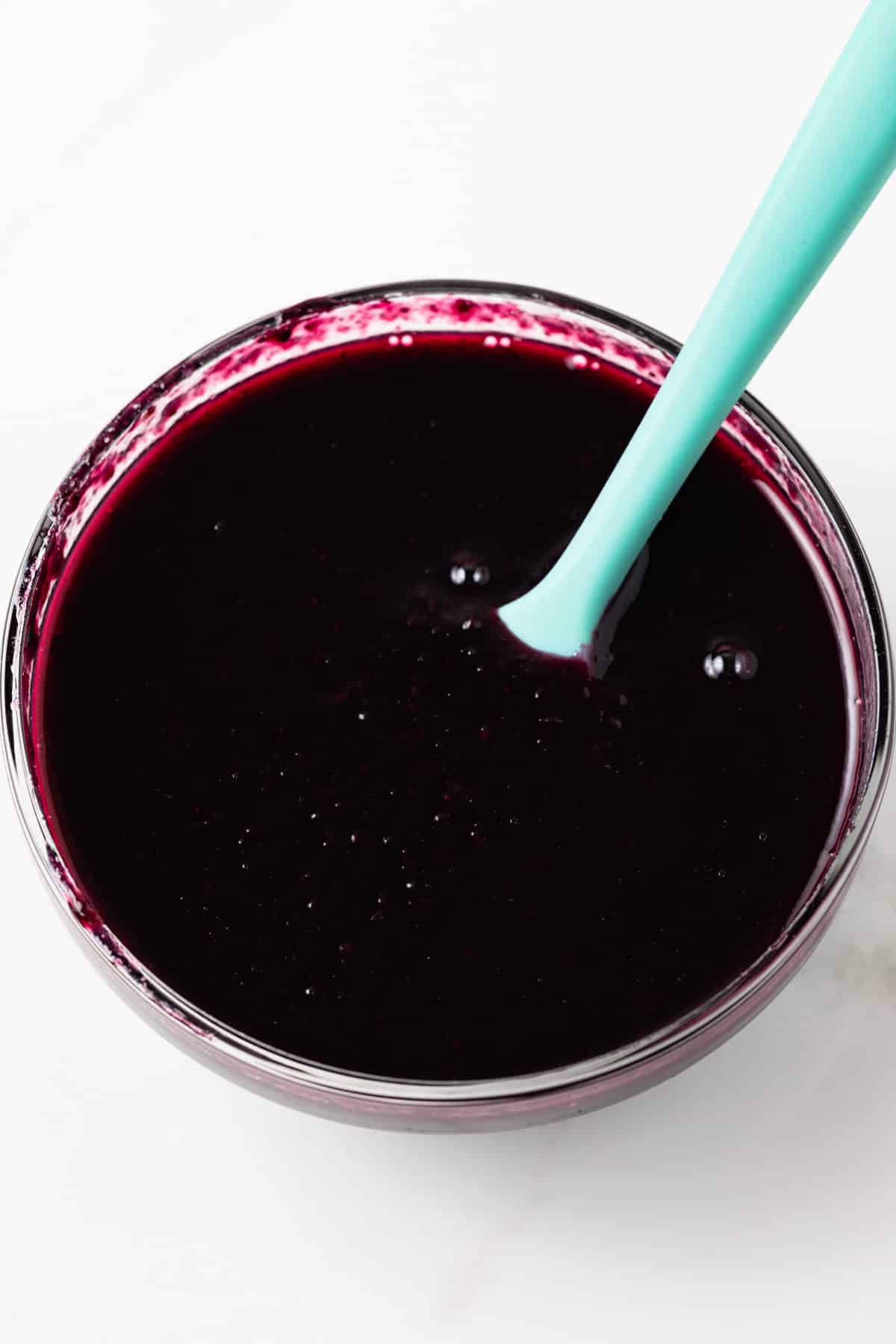 Blueberry jam in glass bowl.