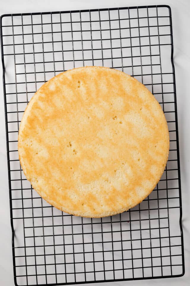 Baked cake layer on cooling rack.
