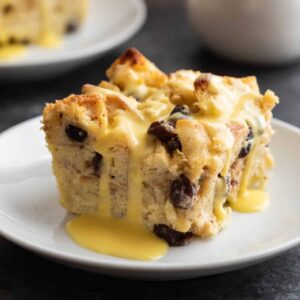 Bead pudding topped with orange custard sauce