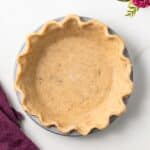Overhead of brown butter pie crust in pie plate.