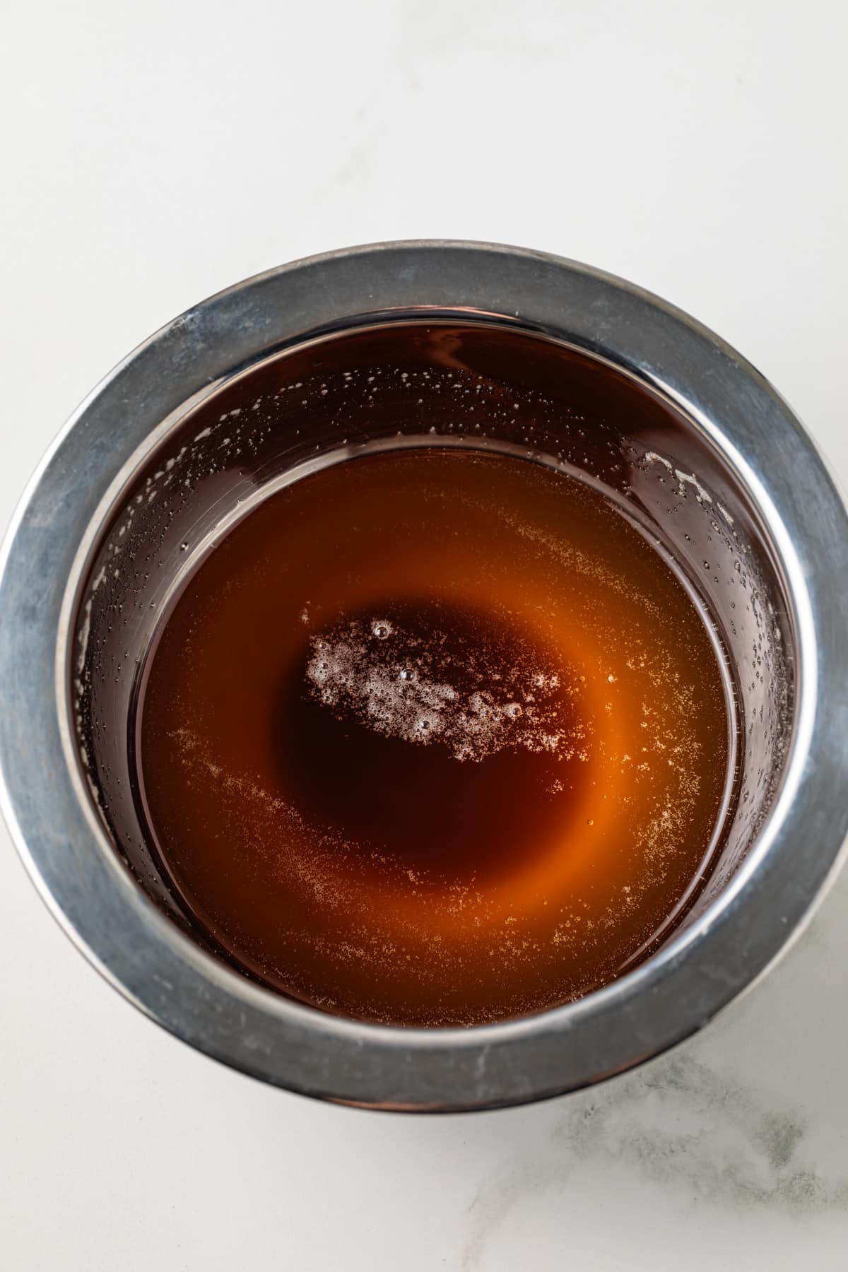 Brown butter in metal bowl.