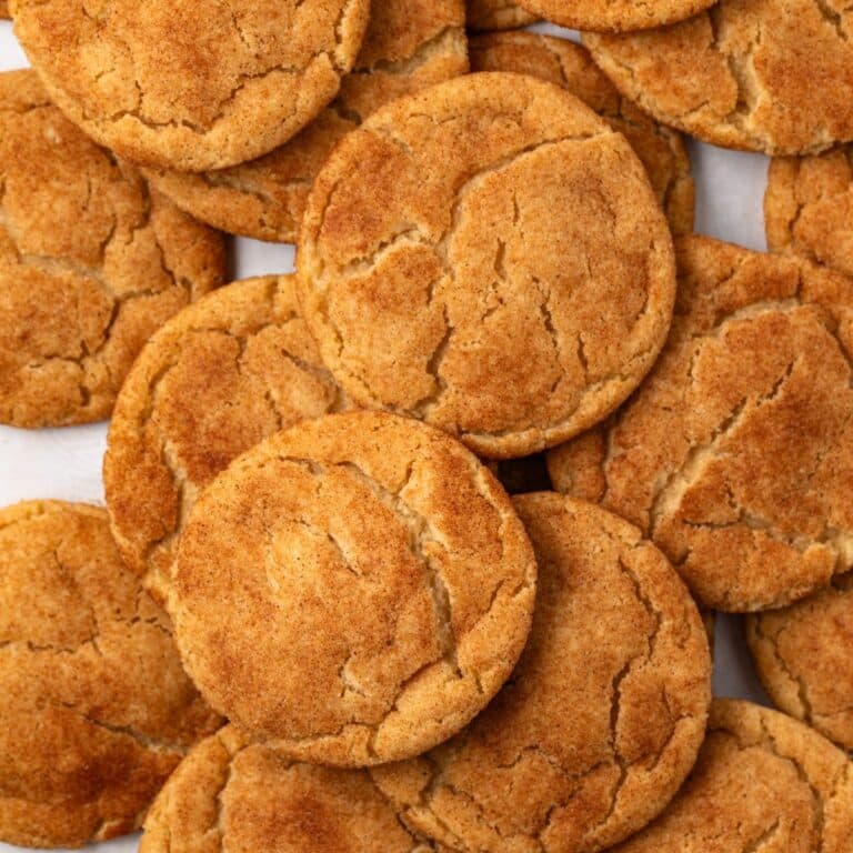 Brown butter snickerdoodles scattered on baking pan.