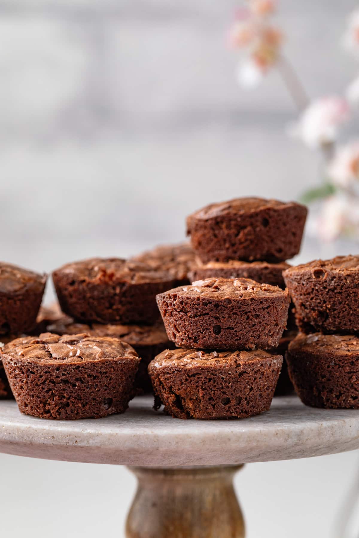Side view of brownie bites on cake stand.
