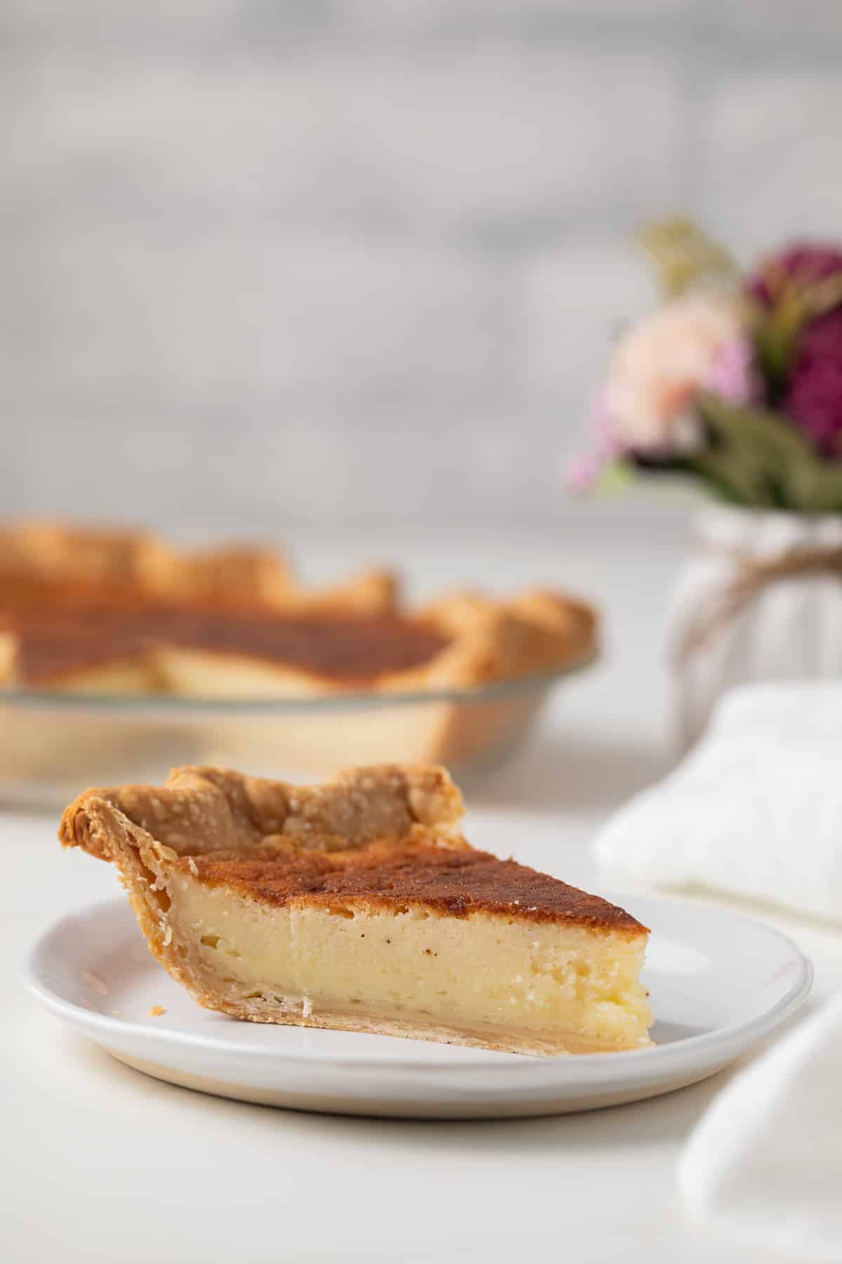Side view of slice of buttermilk pie.
