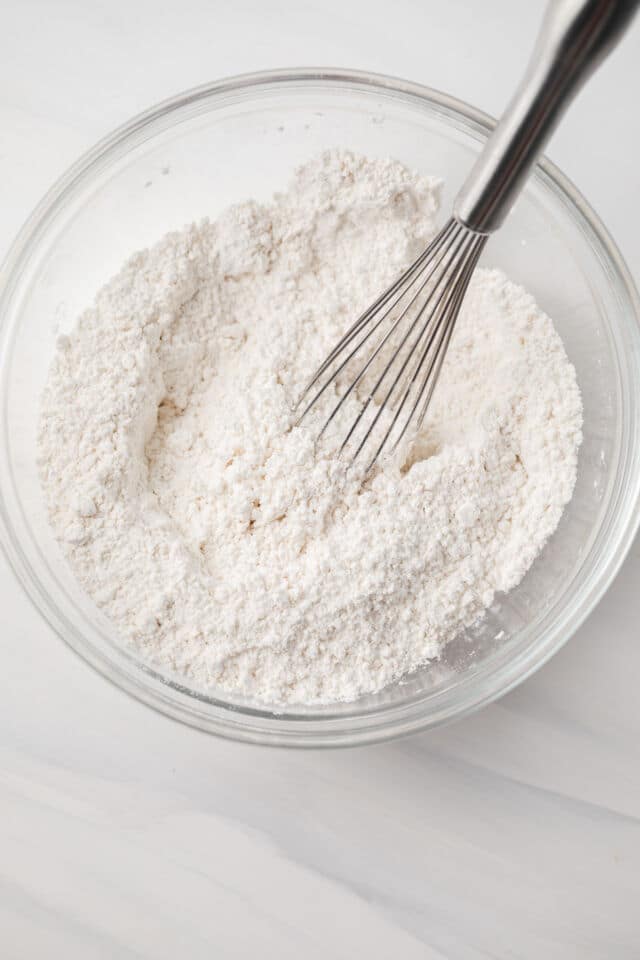 Dry ingredients combined in a glass bowl.