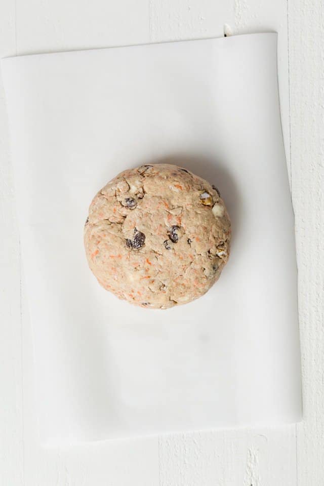 scone dough shaped onto disk on parchment paper