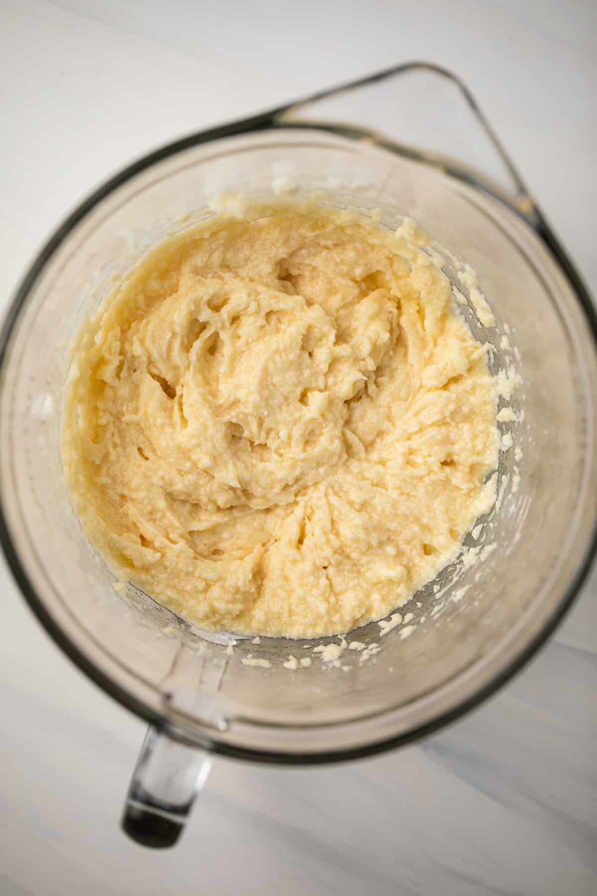 Wet ingredients mixed in glass bowl.