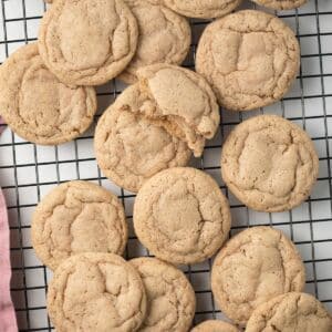 Chai cookies scattered on wire rack.