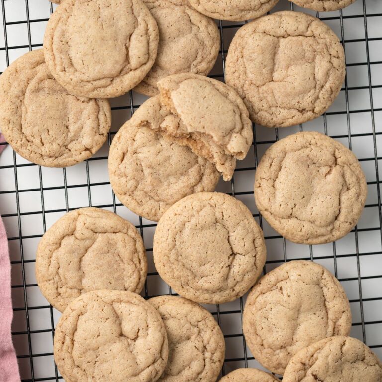 Chai cookies scattered on wire rack.