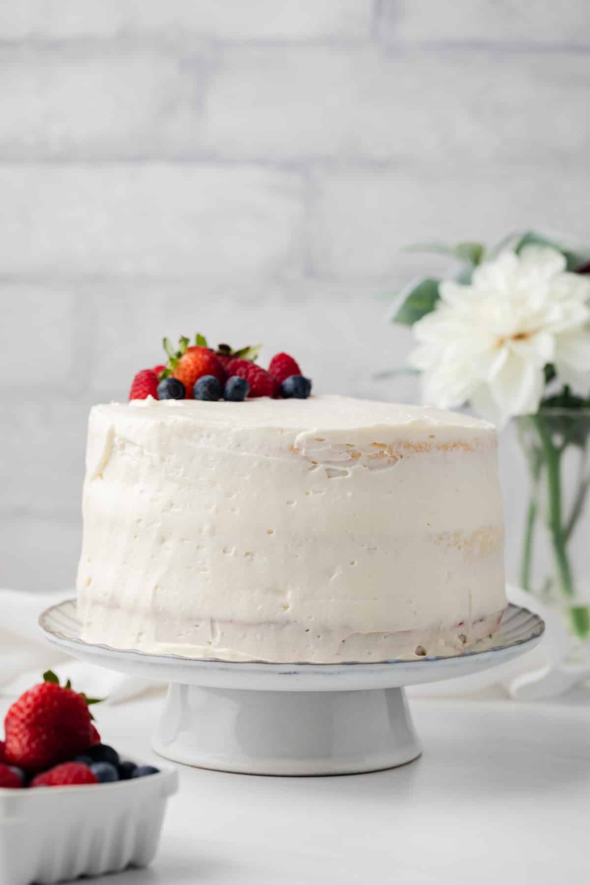 Side view on chantilly cake on a cake stand.