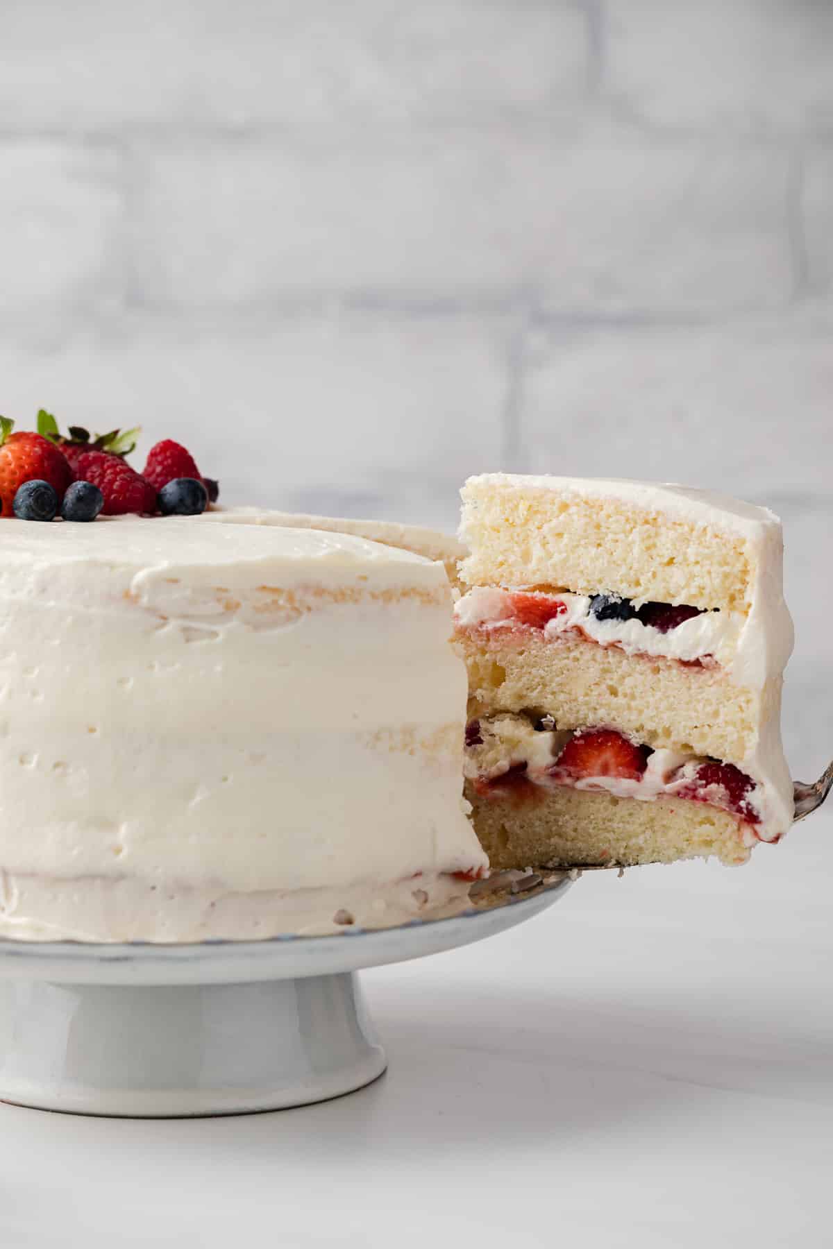 Slice of chantilly cake being taken out.