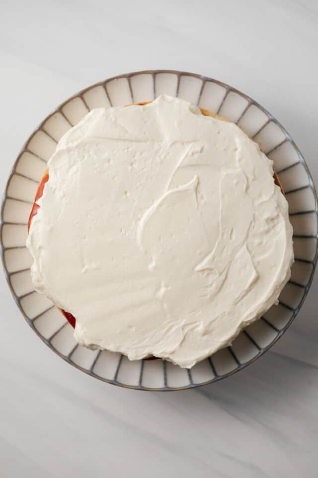 Chantilly cream layered over jam.